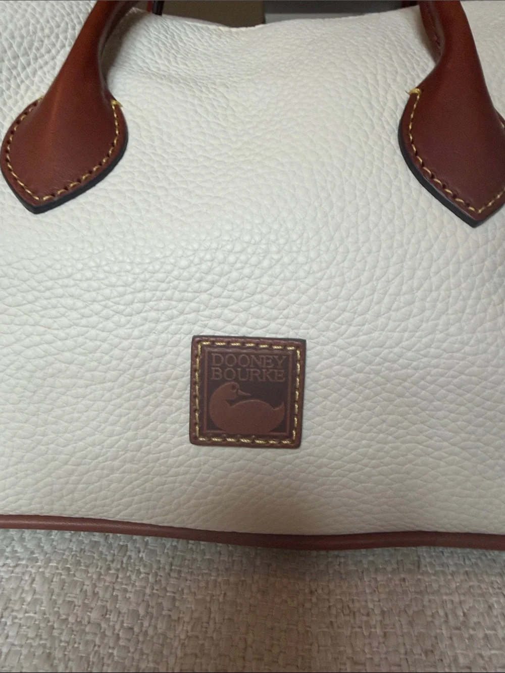 Dooney & Bourke Cream Pebbled Leather Satchel with Brown Trim and Handles
